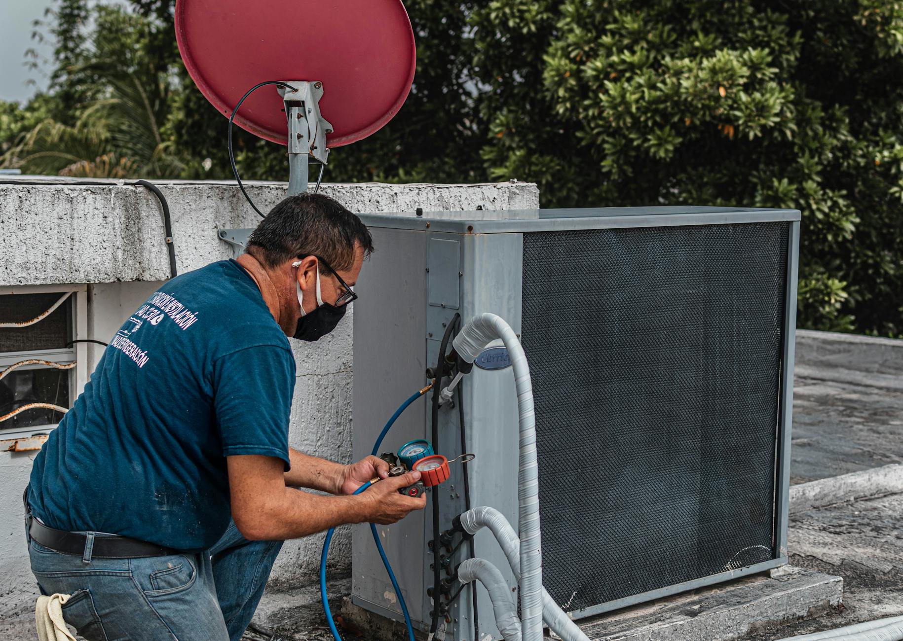 A technician documenting moisture levels in a stucco wall cavity using a professional-grade infrared camera in a La Palma residence.